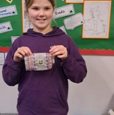 As part of our enquiry we have designed our own Kente cloth and created it through using a running stitch and back stitch